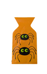 Orange bag with spider designs on a white background